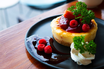 Homemade cheesecake with fresh berries and mint for dessert - healthy organic summer dessert pie cheesecake