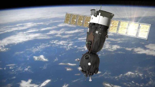 Space ship Soyuz is moving in the orbit and the solar panel is reflecting the sun. It is passing from the right to the left. Background: 'Real World 1'