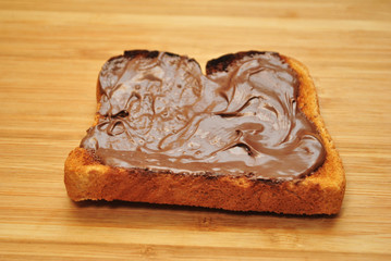 Creamy Chocolate & Nut Spread on a Sliced of Wheat Toast