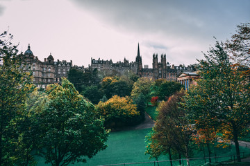 Historic buildings and a green park in Edinburgh, Scotland