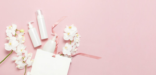 Cosmetics SPA branding mock-up. Flat lay top view White cosmetic bottle containers gift bag White...