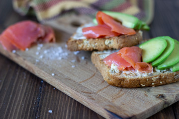 Sandwiches with trout and avocado on a white background. Healthy eating.
