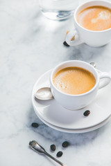 Coffee composition on white marble background. Coffee espresso in white cups