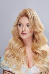portrait of elegant blond with long hair looking to the side