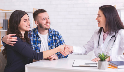Fototapeta premium Young couple at doctor's office during visit