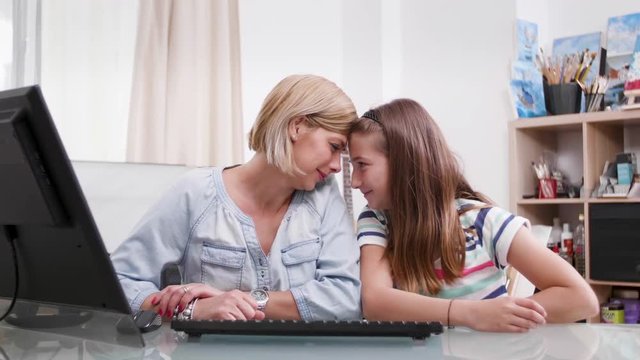 Mother and daughter showing affection to each other. Portrait of a young female and a teenage girl showing love to each other.