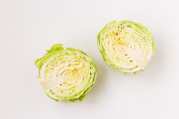 Obraz premium Cabbage halves are located on a white background