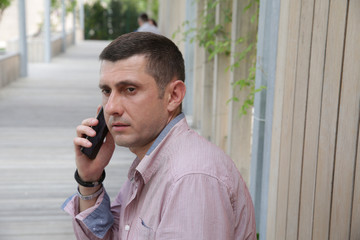 close-up. Portrait of a handsome young man businessman talking on cell phone