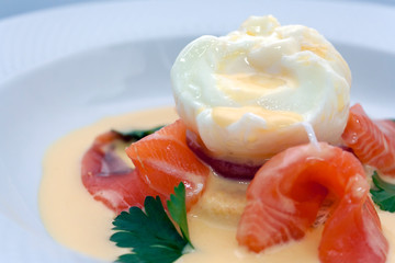 poached egg on fresh tomato and thinly sliced salmon