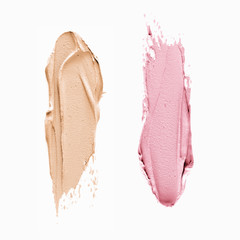 Fototapeta premium Pink and Beige Make-up two smudges on isolated background 