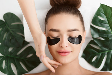 Girl With Black Hydro Gel Eye Patches, Top View
