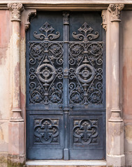 The wrought door of the stone crypt on the Montjuic Cemetery closeup front view, Barcelona, Catalonia, Spain