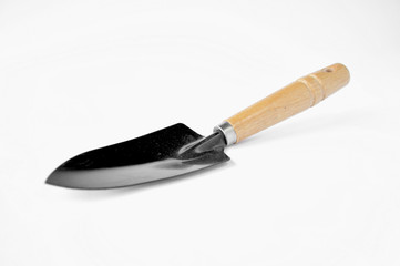 black garden shovel with a wooden handle on a white background