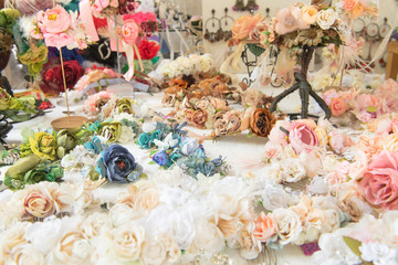 Ornamental flowers in the foreground on table exposed.