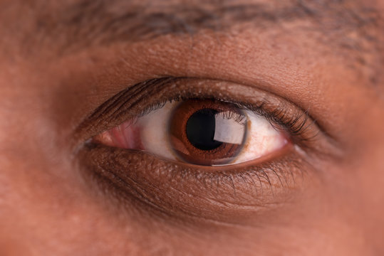african american dark brown eye close up large pupil
