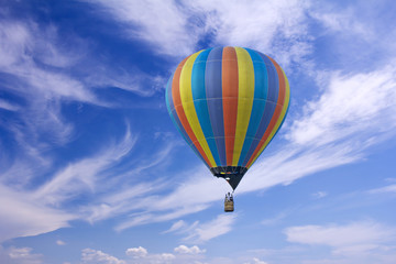 Colorful hot-air balloon flying in the blue sky