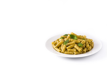 Penne pasta with pesto sauce and basil on a plate, isolated on white backgCopyspaceround.