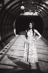 Fototapeta premium Beautiful girl stand in tunnel in the hotel