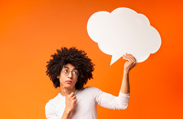 African american man holding blank speech bubble