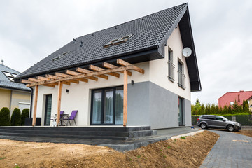 House with new laid concrete paver blocks