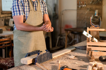 Bearded carpenter master have tossed. the hands of sawdust, dust flying in different directions in the Studio closeup