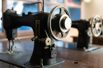 sewing machine,old sewing machine,vintage style,soft focus.