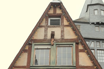 Half timbered house with a pulley on the roof (Bacharach, Germany, Europe)