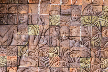 Fototapeta premium face of buddha in the wall , Sculpture on temple wall , thailand