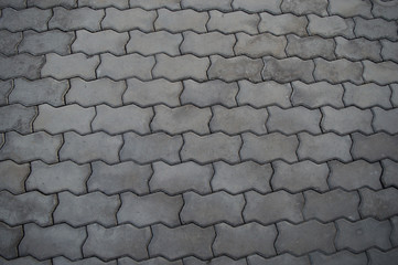 surface paved with road tiles. top view. Specially prepared background for seamless fill.