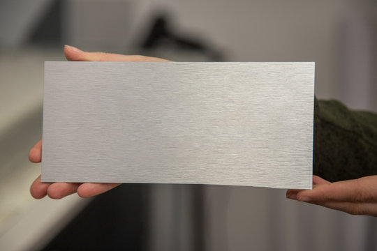 metal card dibond brushed aluminum material in hand