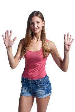 Happy woman in shorts showing nine fingers