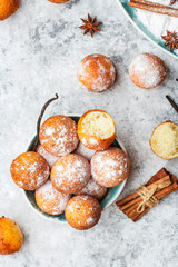 small balls cottage cheese doughnuts in powdered sugar