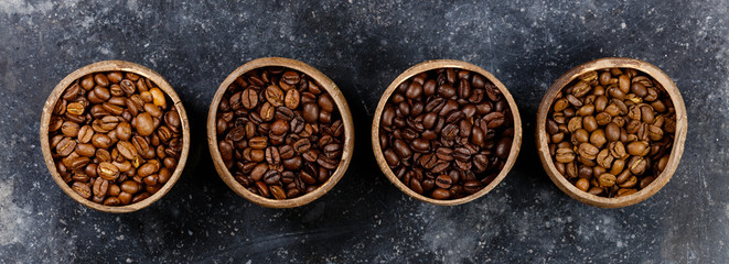 Four different varieties of coffee beans, flat lay, top view