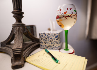 glass of white wine next to your list of things to do