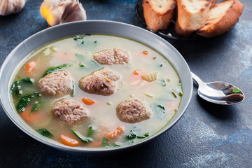 Italian wedding soup with meatballs and vegetables