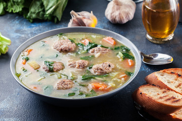 Italian wedding soup with meatballs and vegetables