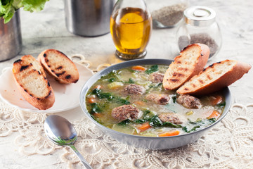 Italian wedding soup with meatballs and vegetables