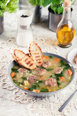 Italian wedding soup with meatballs and vegetables