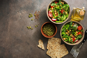 Bowls healthy vegan salad,chickpea, lettuce, tomato, microgreen, radish, cucumber, flax seeds and...