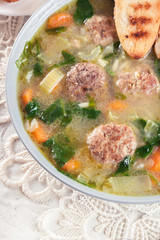 Italian wedding soup with meatballs and vegetables