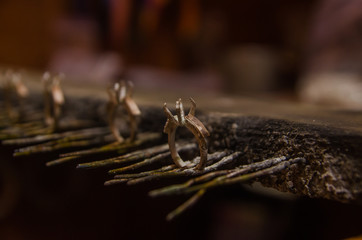 Attacking gold on a silver jewelry. Close up