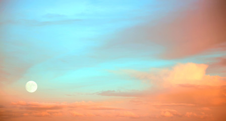 full moon at sunset