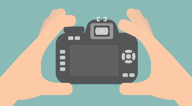 Taking a photo concept. Hands holding a digital camera