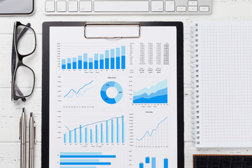 Office workplace table with report page