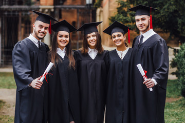 Study together. Good mood. . Group of Students. Mantles. standing. Freelance. Knowledge.