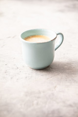 Fototapeta na wymiar A cup of coffee on light grey background