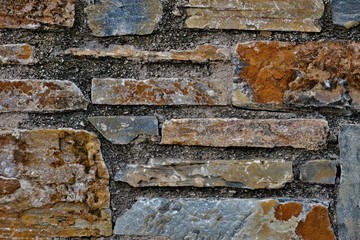 unusual background wall of different stones of different colors