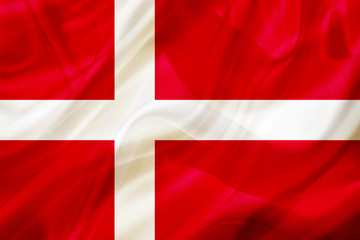 Fototapeta premium Denmark country flag on silk or silky waving texture