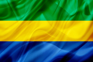 Gabon country flag on silk or silky waving texture