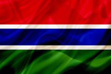 Gambia country flag on silk or silky waving texture